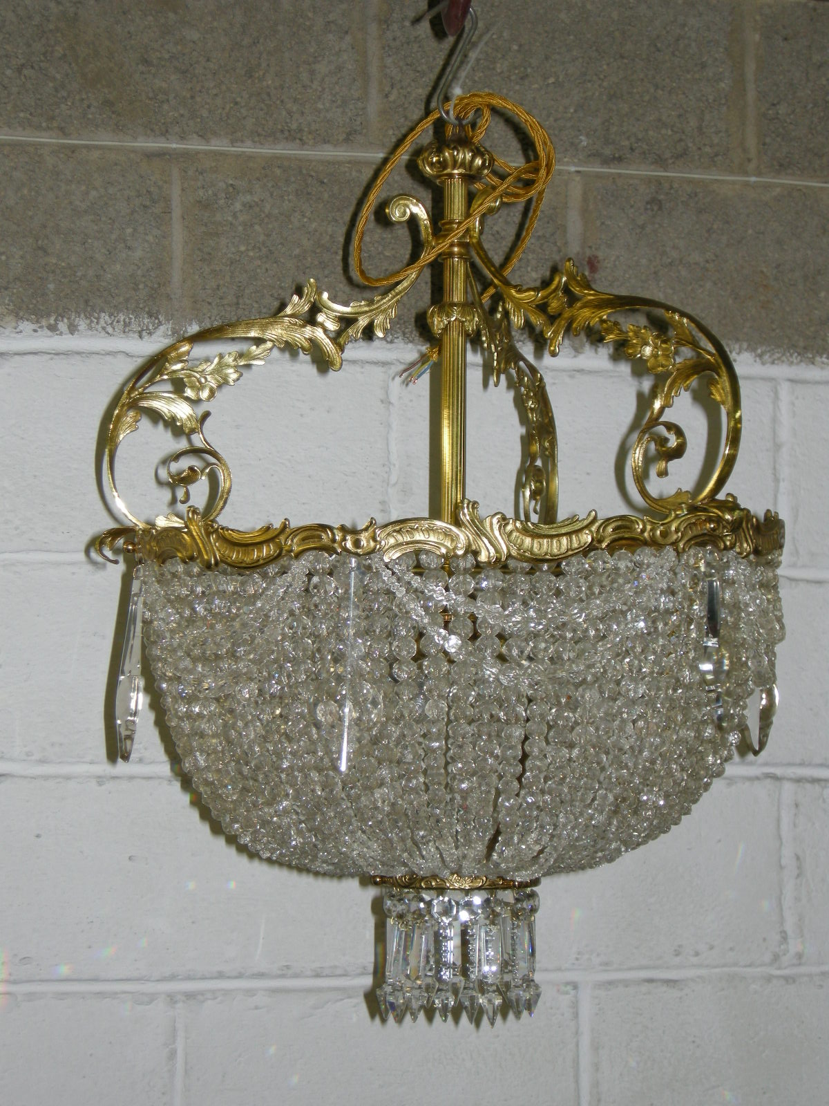 brass and glass chandelier after restoration
